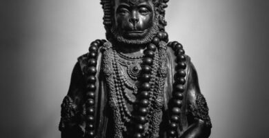 gold buddha figurine on black table